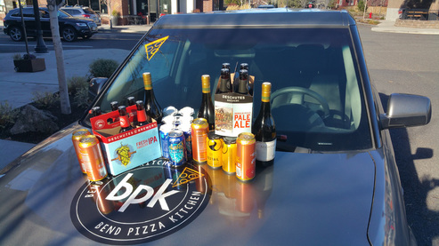 Beer and Wine pictured on a car